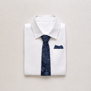 Batik blue printed neck tie and pocket square in a folded suit
