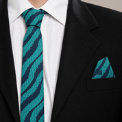 green and blue printed necktie and pocket square at a suit