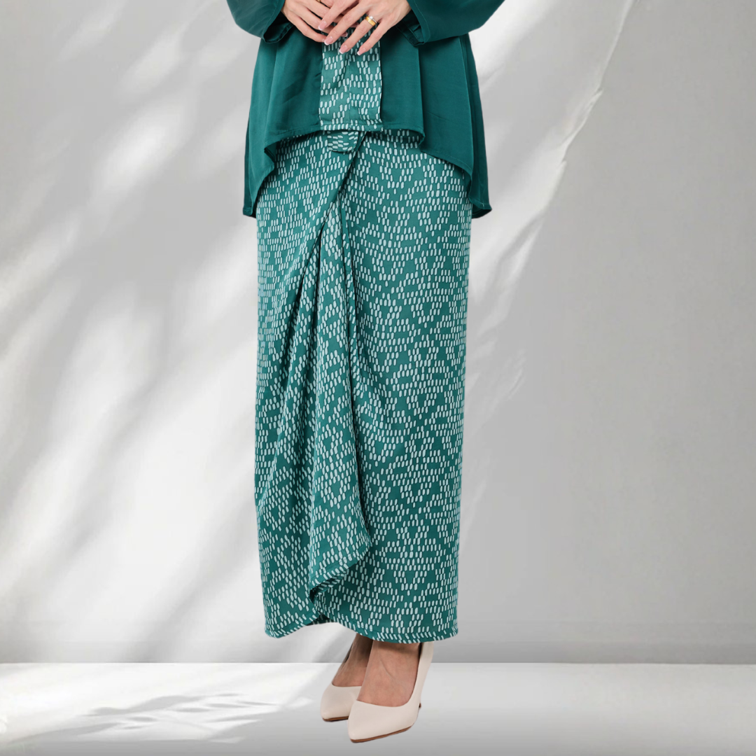 Teal outfit with patterned pants on a white background