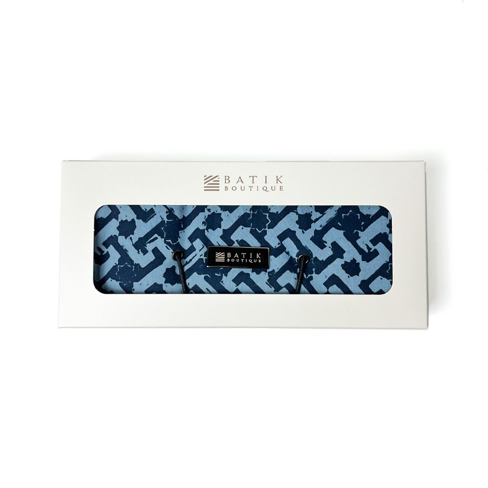 Wall hooks with blue geometric pattern in a Batik Boutique box on a white background