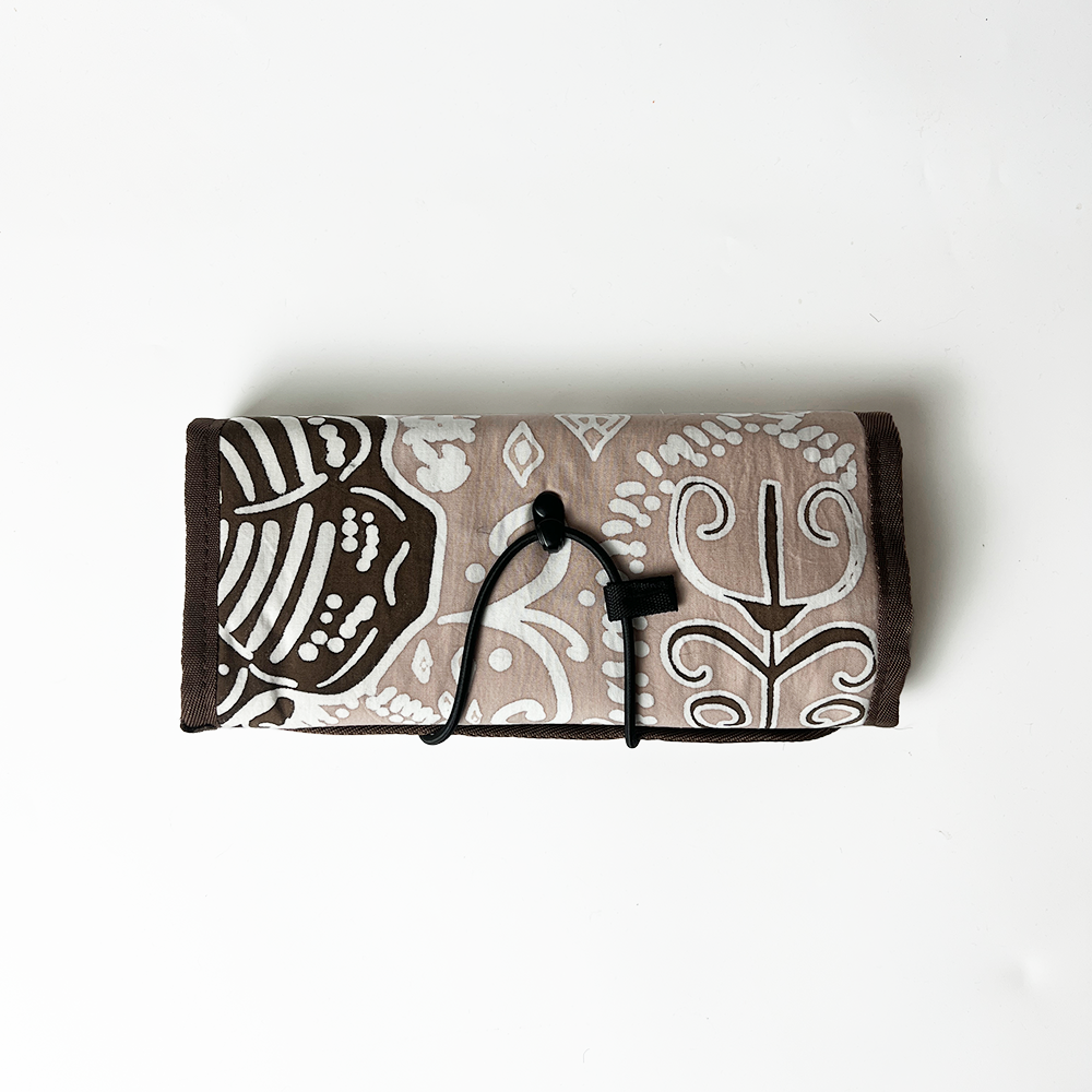 Foldable fabric tray with brown and beige pattern on a white background