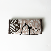 Foldable fabric tray with brown and beige pattern on a white background