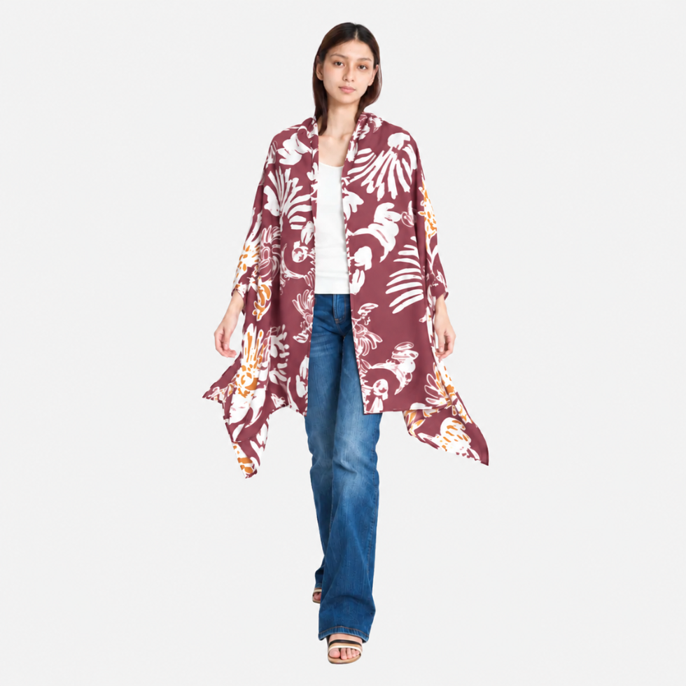 Woman wearing maroon printed batik scarf facing front