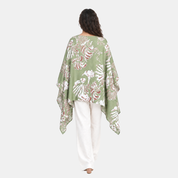 Woman facing the back wearing green scarf