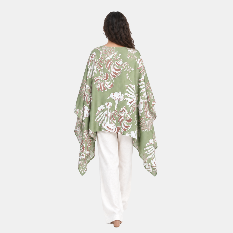 Woman facing the back wearing green scarf