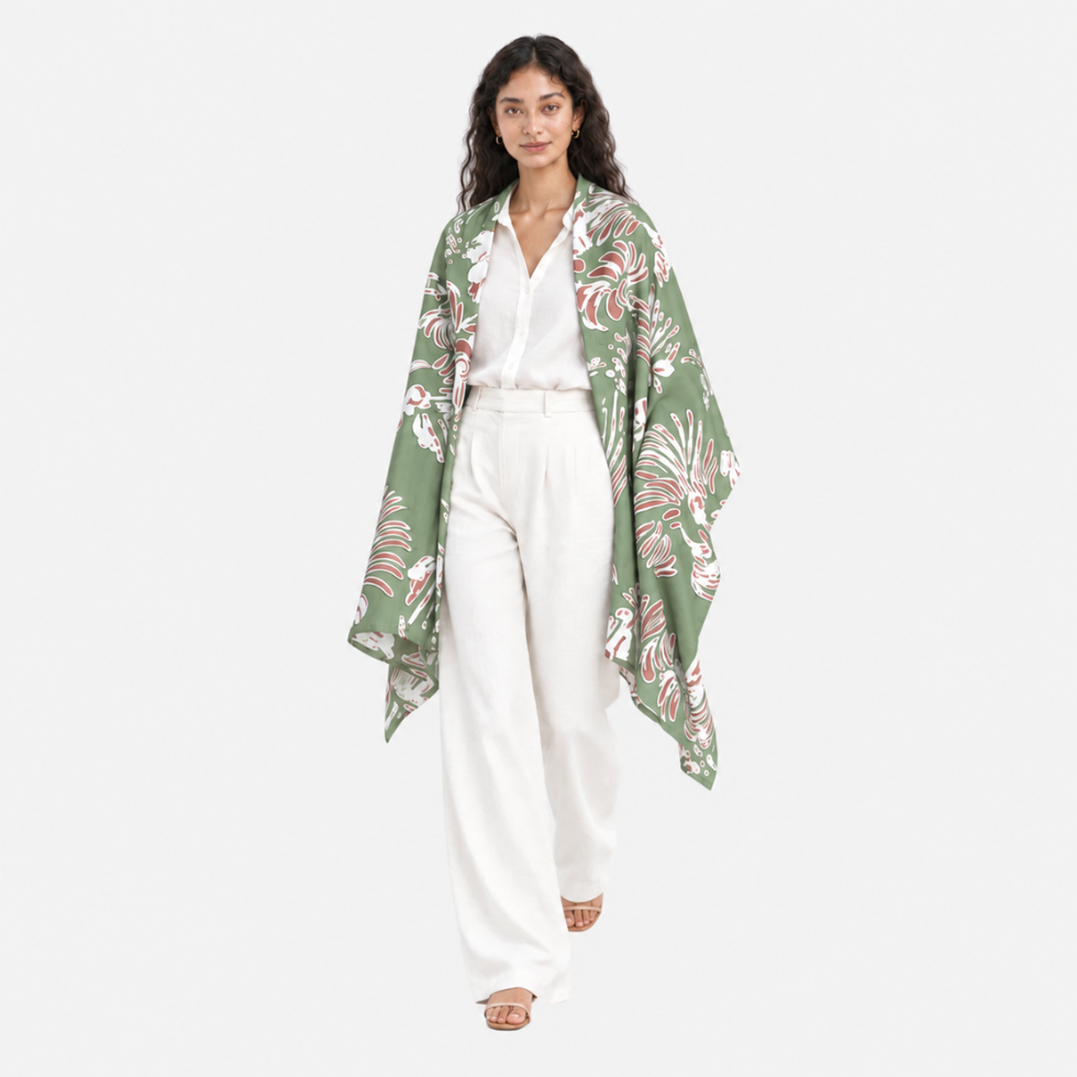 Lady facing front wearing green printed batik scarf