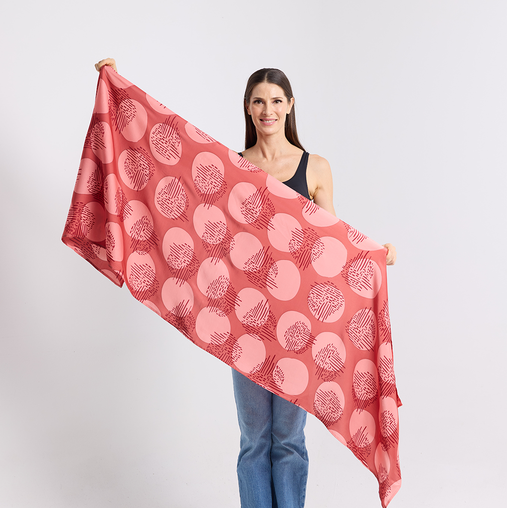 women holding the crimson yuan dian scarf to display the pattern and the color 