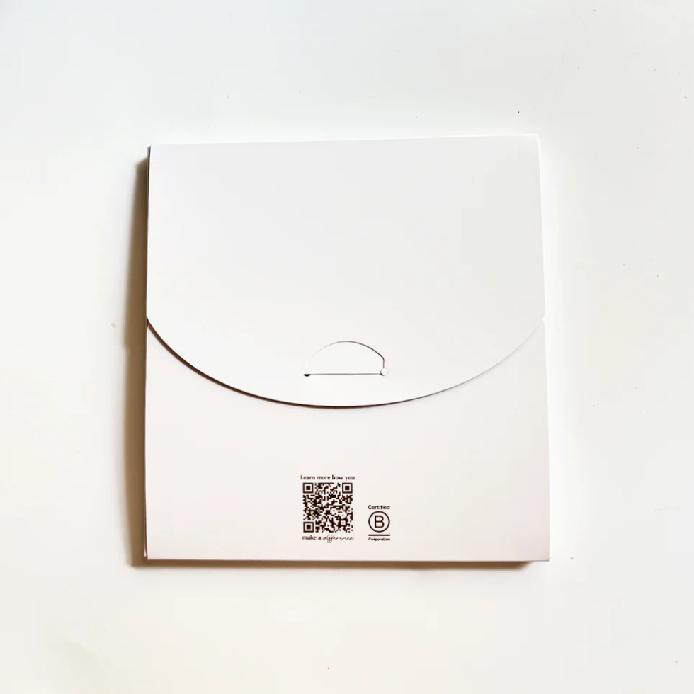 White envelope with a QR code and logo on a white background