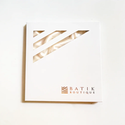 White card with gold geometric design and 'Batik Boutique' logo on a white background