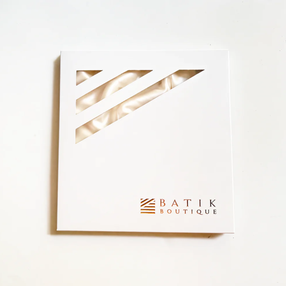 White card with gold geometric design and 'Batik Boutique' logo on a white background