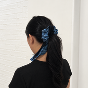 Lady wearing blue printed batik scrunchy