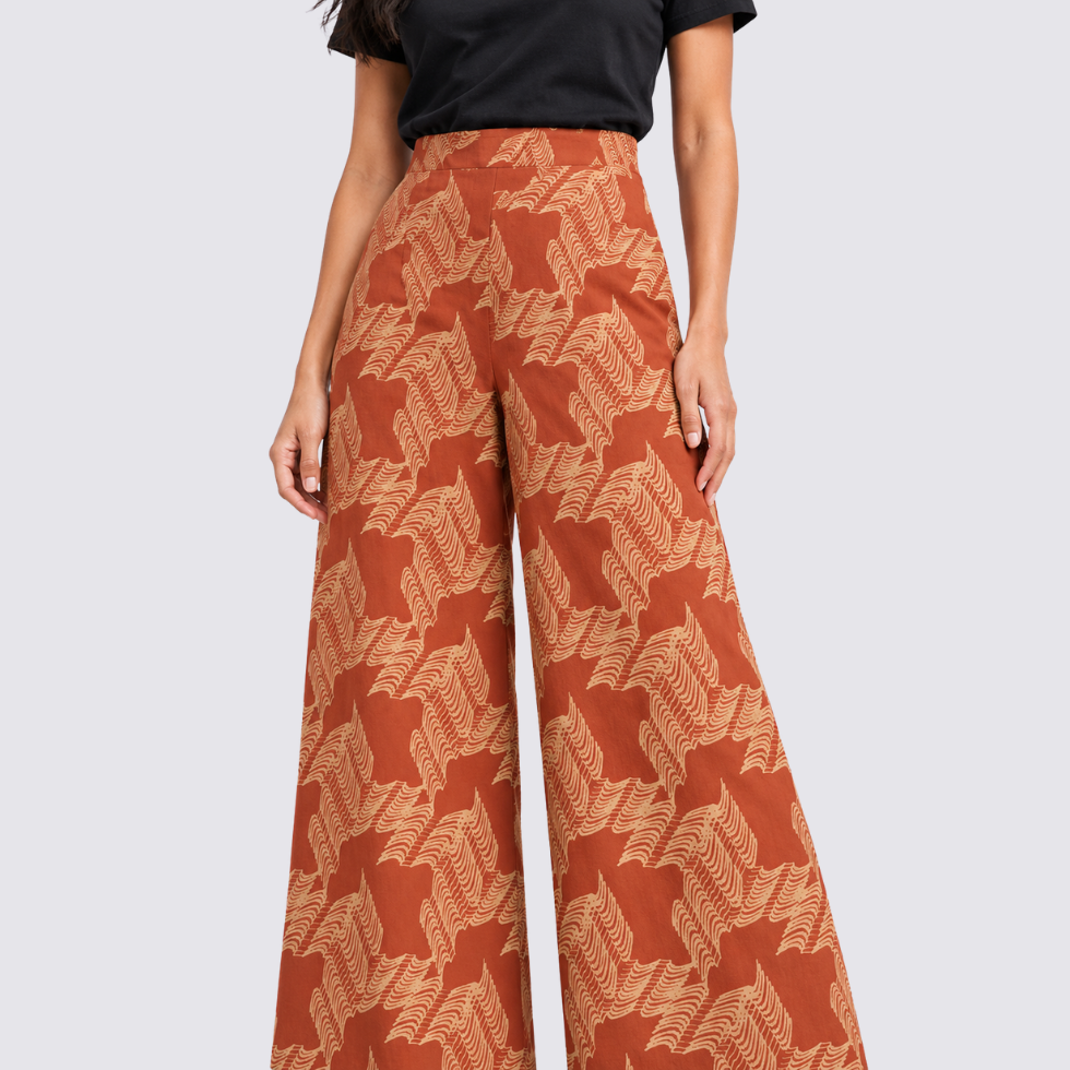 Closeup of woman wearing orange printed batik pants