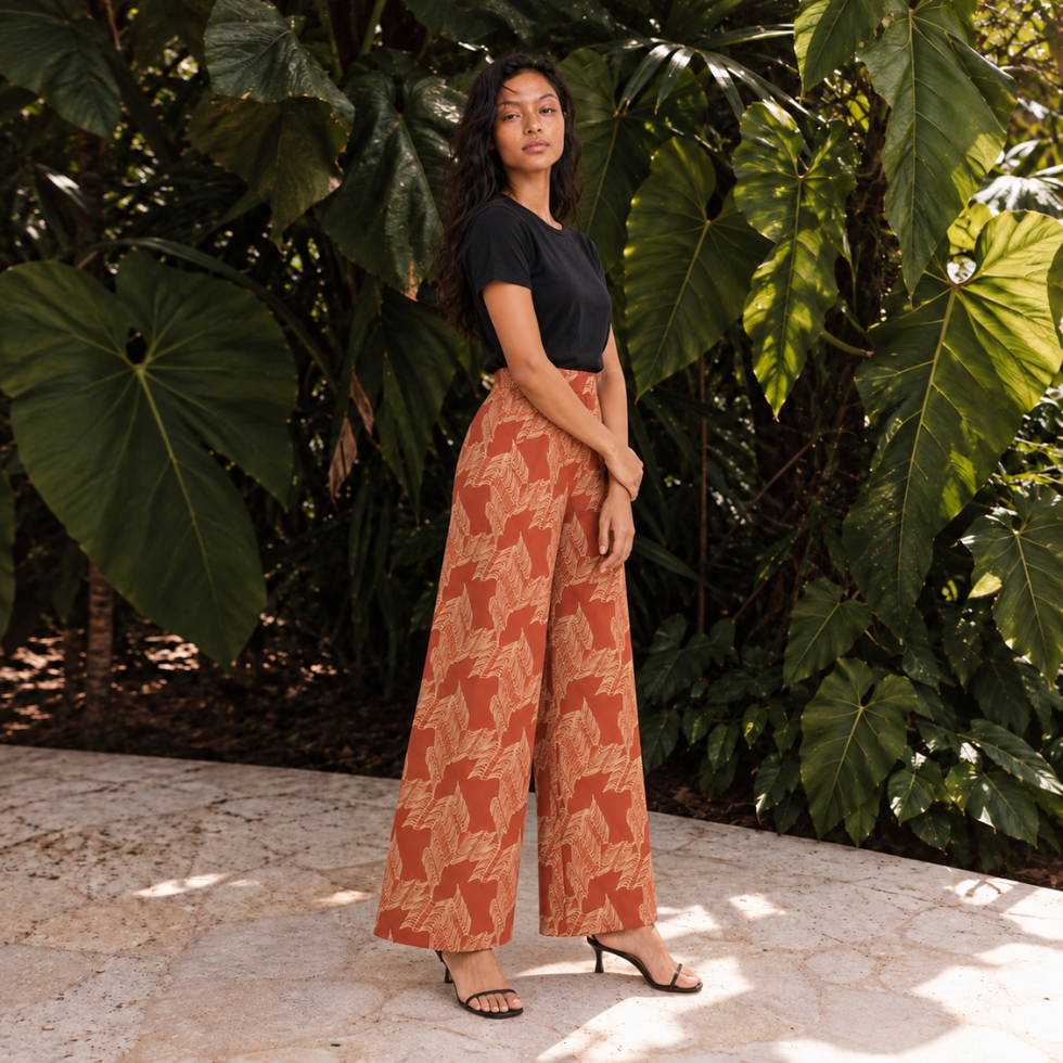 Woman wearing orange printed batik pants outside