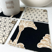 close up view of Black coconut coasters 