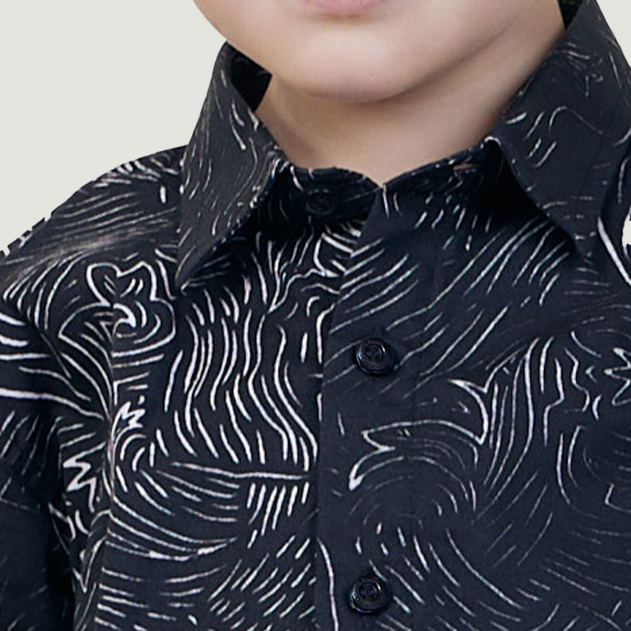 a closeup view of a black driftwood patterned batik shirt