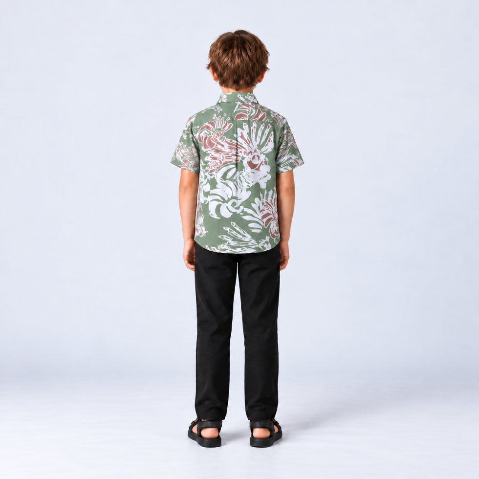 Boy facing back wearing green printed batik shirt