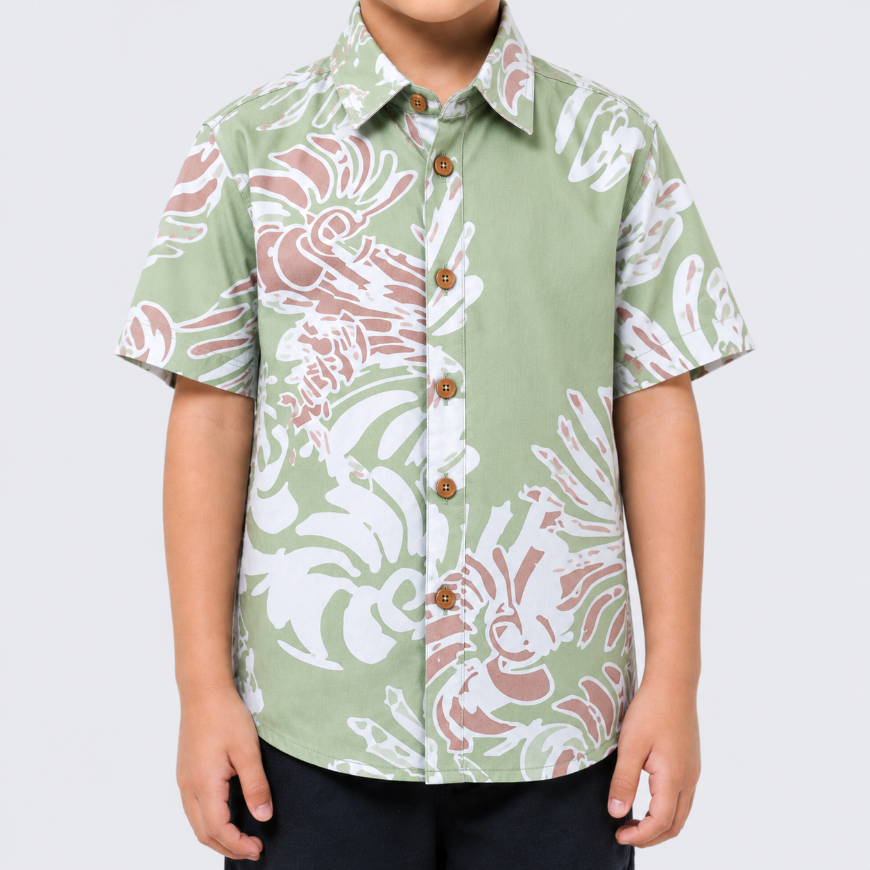 Closeup of kid wearing green shirt
