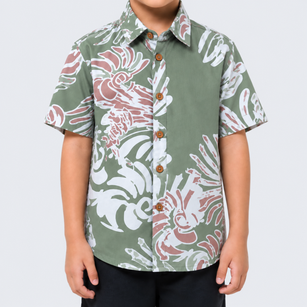 Closeup of boy wearing green printed batik shirt