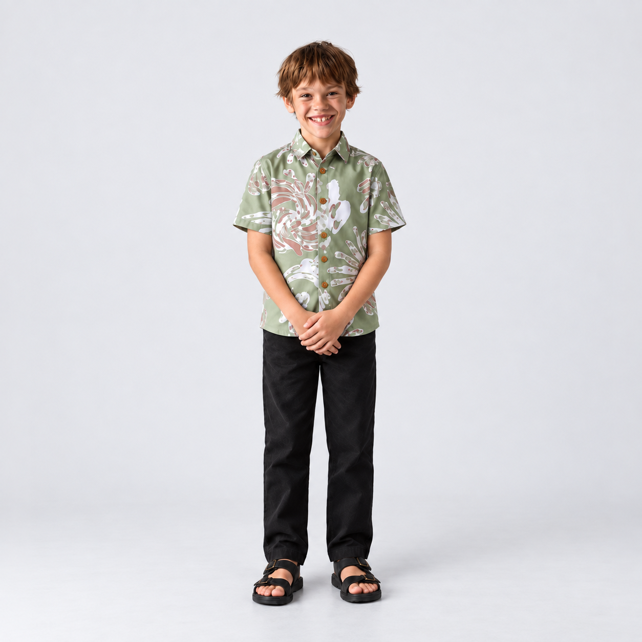 Kid smiling wearing green shirt