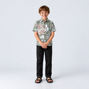 Boy facing front showing green printed batik shirt
