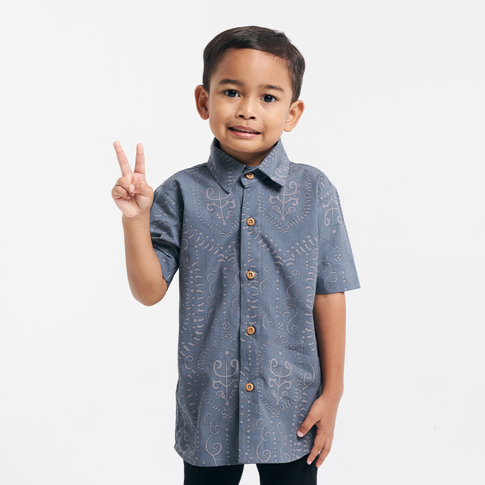 little boy wearing the batik boy shirt in steel petola 