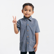 little boy wearing the batik boy shirt in steel petola 