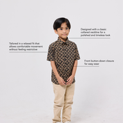 Child wearing a patterned shirt and beige pants on a white background with text about the shirt's features.