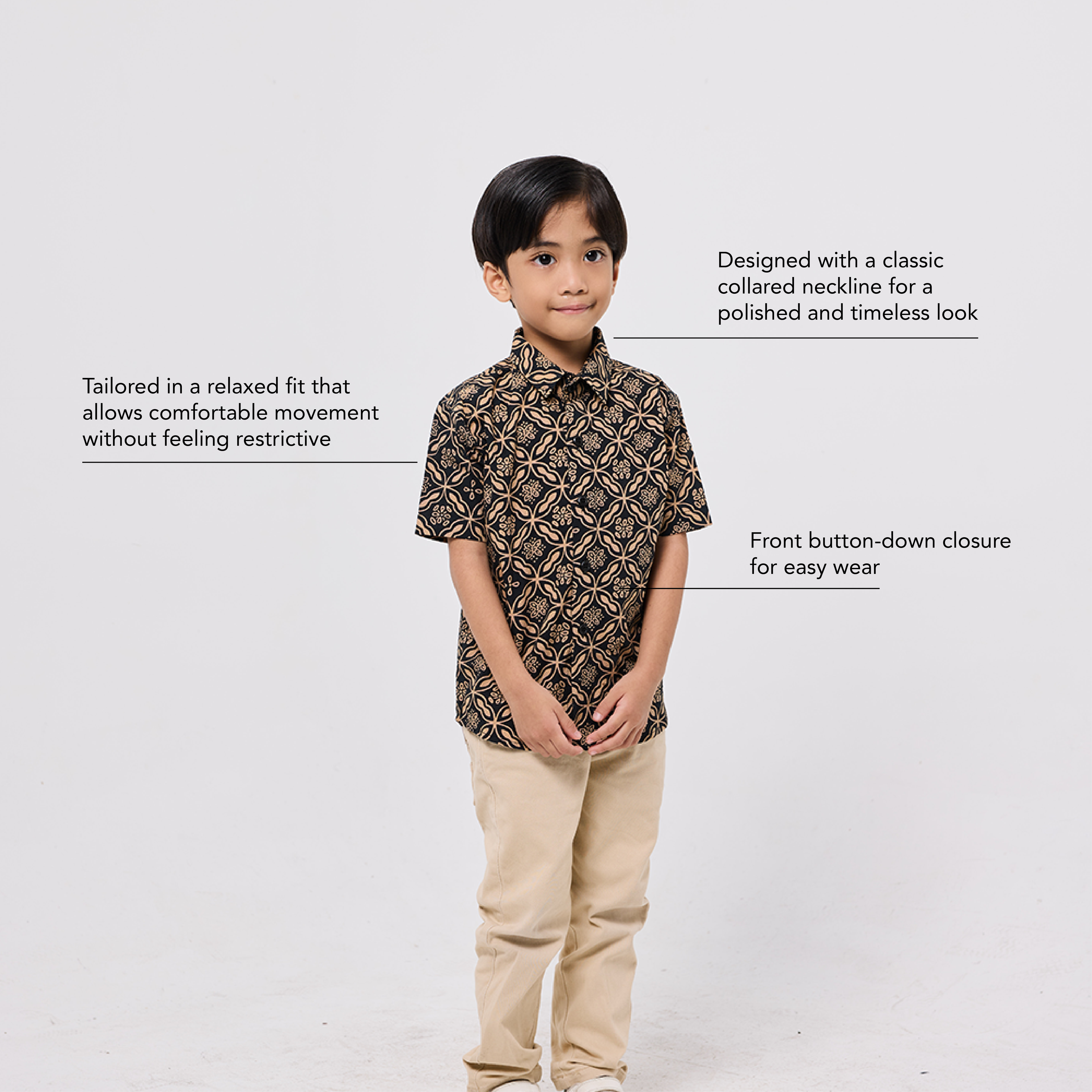 Child wearing a patterned shirt and beige pants on a white background with text about the shirt's features.