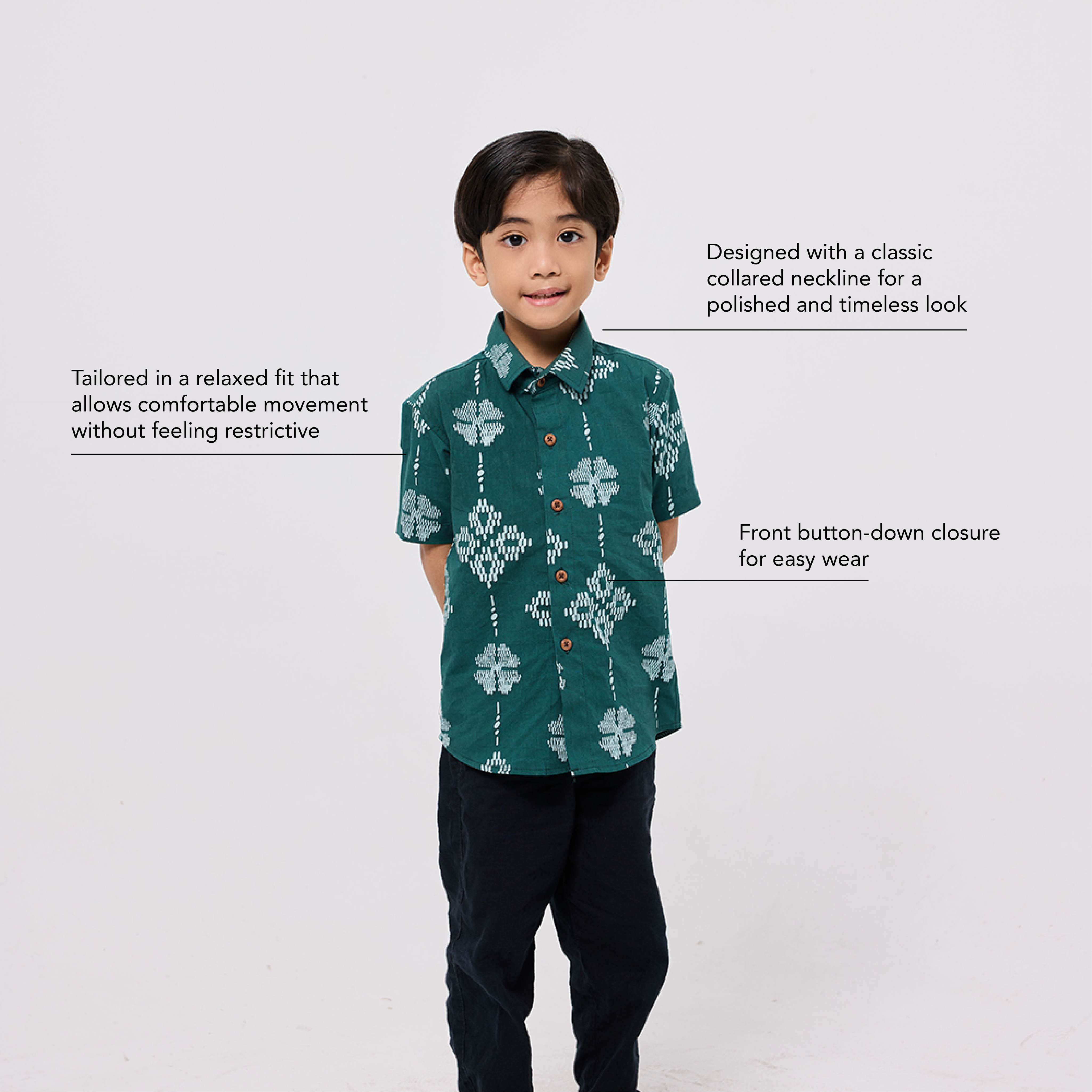 Child wearing a green patterned shirt with text describing its features on a white background