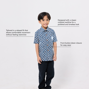 Child wearing a blue patterned shirt with text describing its features on a white background