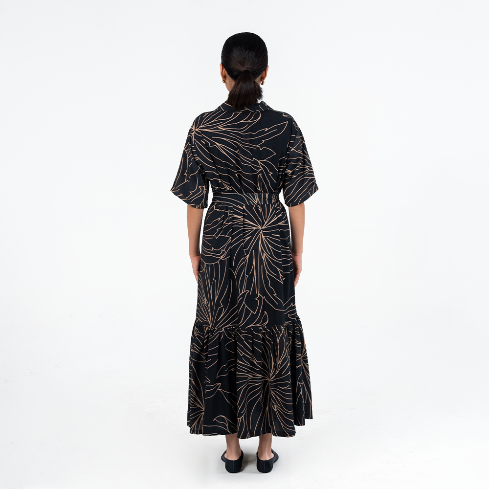Back view of Batik Boutique’s Onyx Palma Button-Up Dress highlighting the batik motif and flowy A-line cut