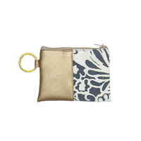 a picture of a card holder wallet in the pattern grey peony in front of a neutral background, showcasing the details on the back