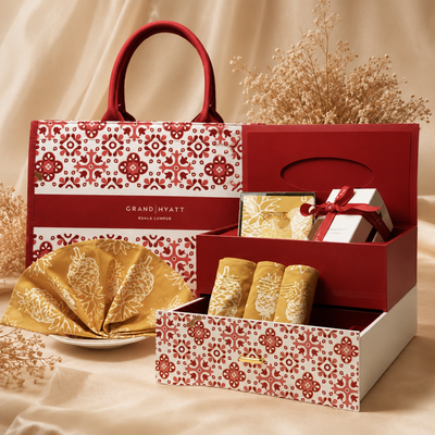 Gift set with a patterned bag and box on a beige background