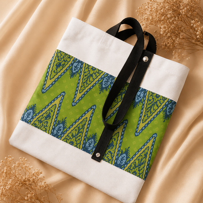 Tote bag with green and blue pattern on a beige fabric background