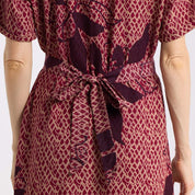 close up detailed shot the back of the button up copper blooming lace dress 
