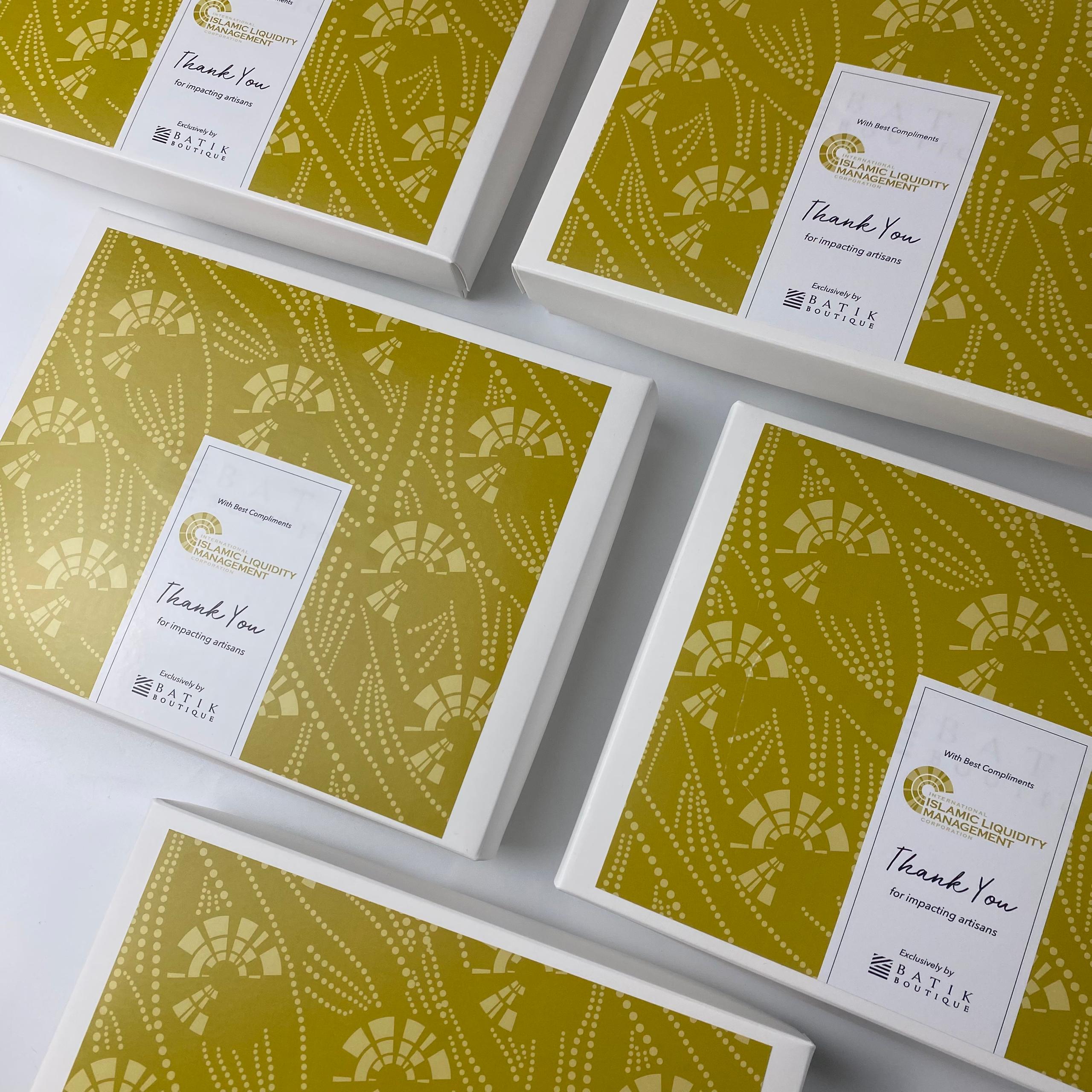 Set of green patterned boxes with 'Thank You' cards on a white background