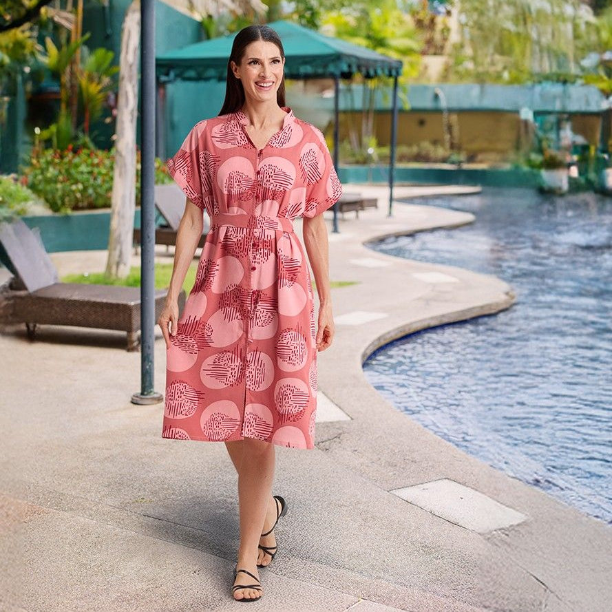 women wearing Crimson Ayaz dress being shown in a lifestyle photo by the pool
