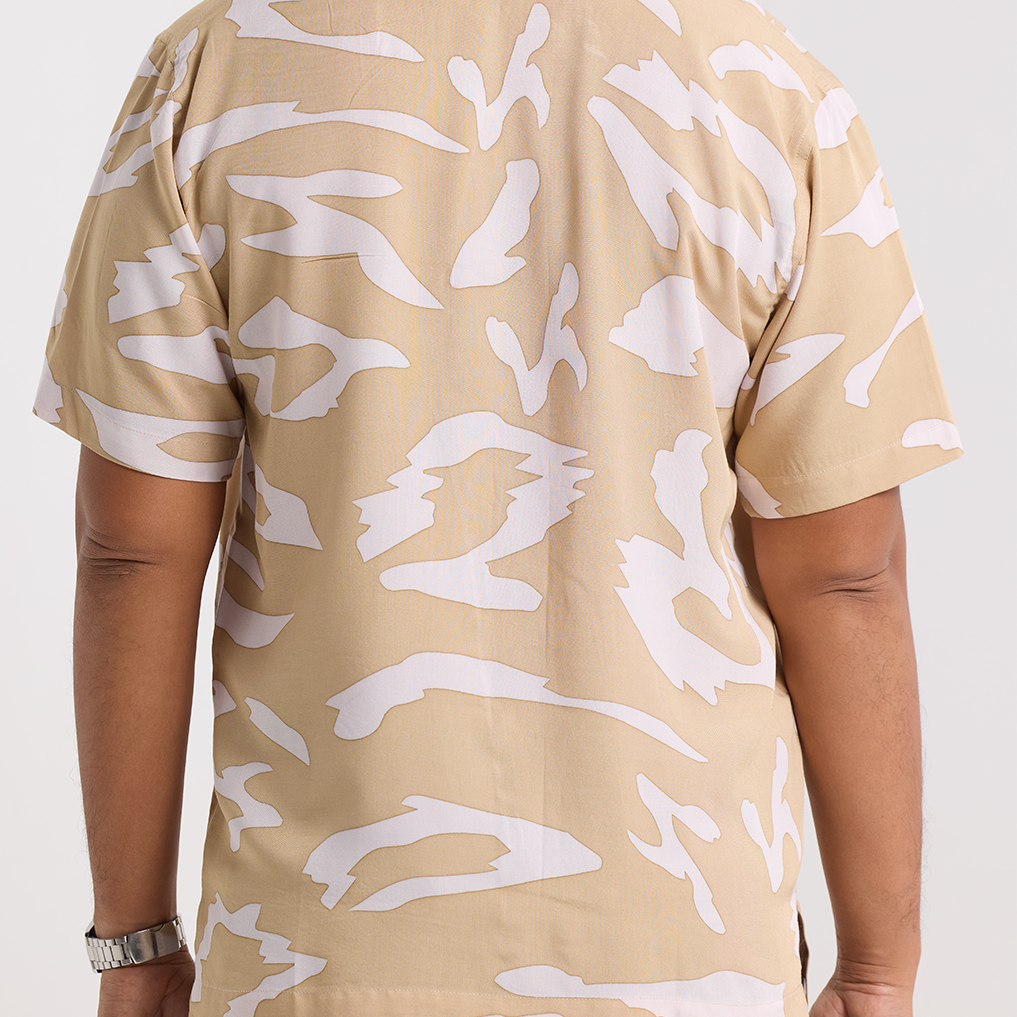 Zoomed in photo of the tan rimba shirt showing the detail of the shirt 