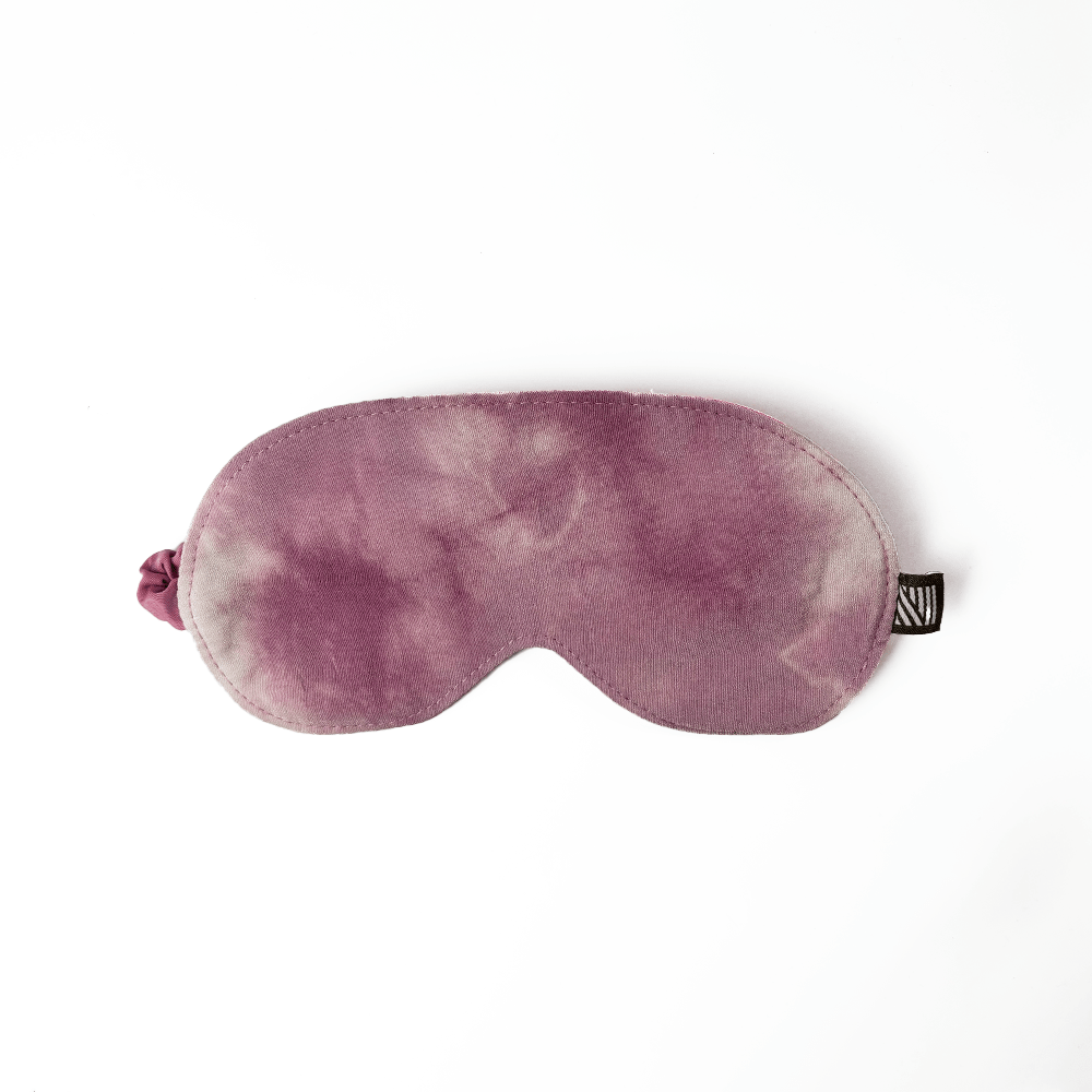 Hand-dyed plum shibori eye mask made from soft fabric with tie-dye texture, handcrafted by Malaysian artisans.