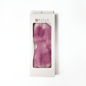 Plum Shibori eye mask by Batik Boutique packaged in white box with viewing window, featuring unique hand-dyed batik pattern.