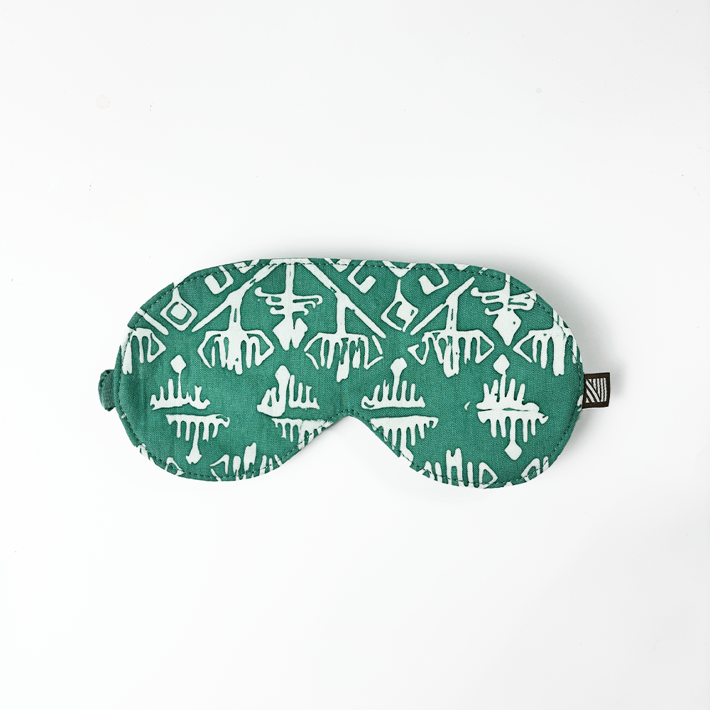 Turquoise batik eye mask featuring white geometric tikar motif, handcrafted by Malaysian artisans at Batik Boutique.