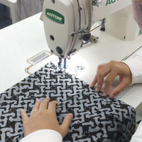 A seamstress in the process of sewing batik shirt