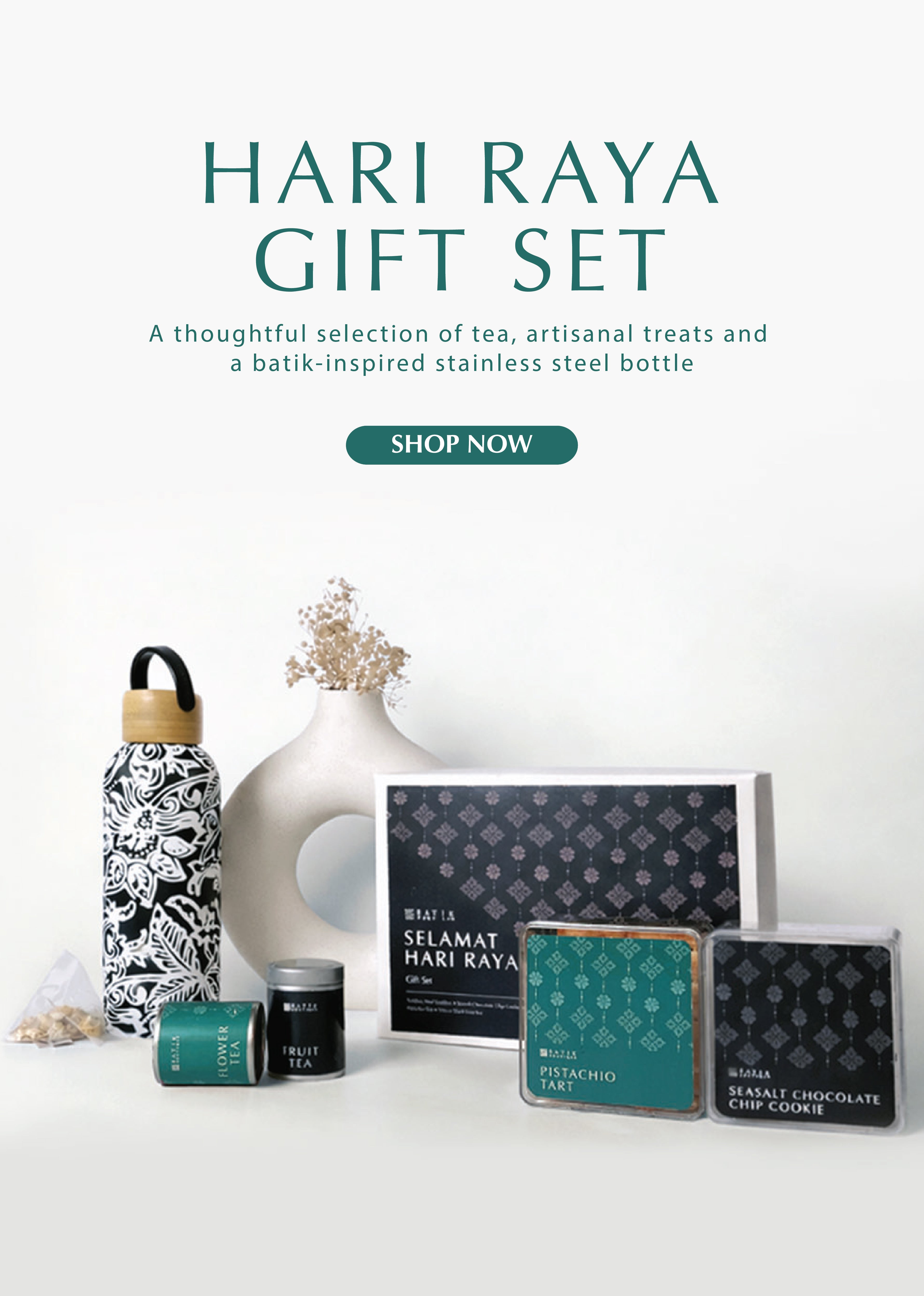 Hari Raya gift set with tea, treats, and a bottle on a white background