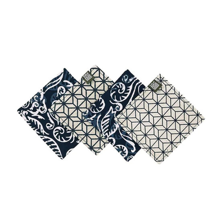 a four piece set of coasters made of authentic batik in the pattern blue nautical fern against a white background