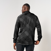 Model wearing the Black Alur batik shirt, showcasing the back design with a tailored slim fit and unique batik pattern.