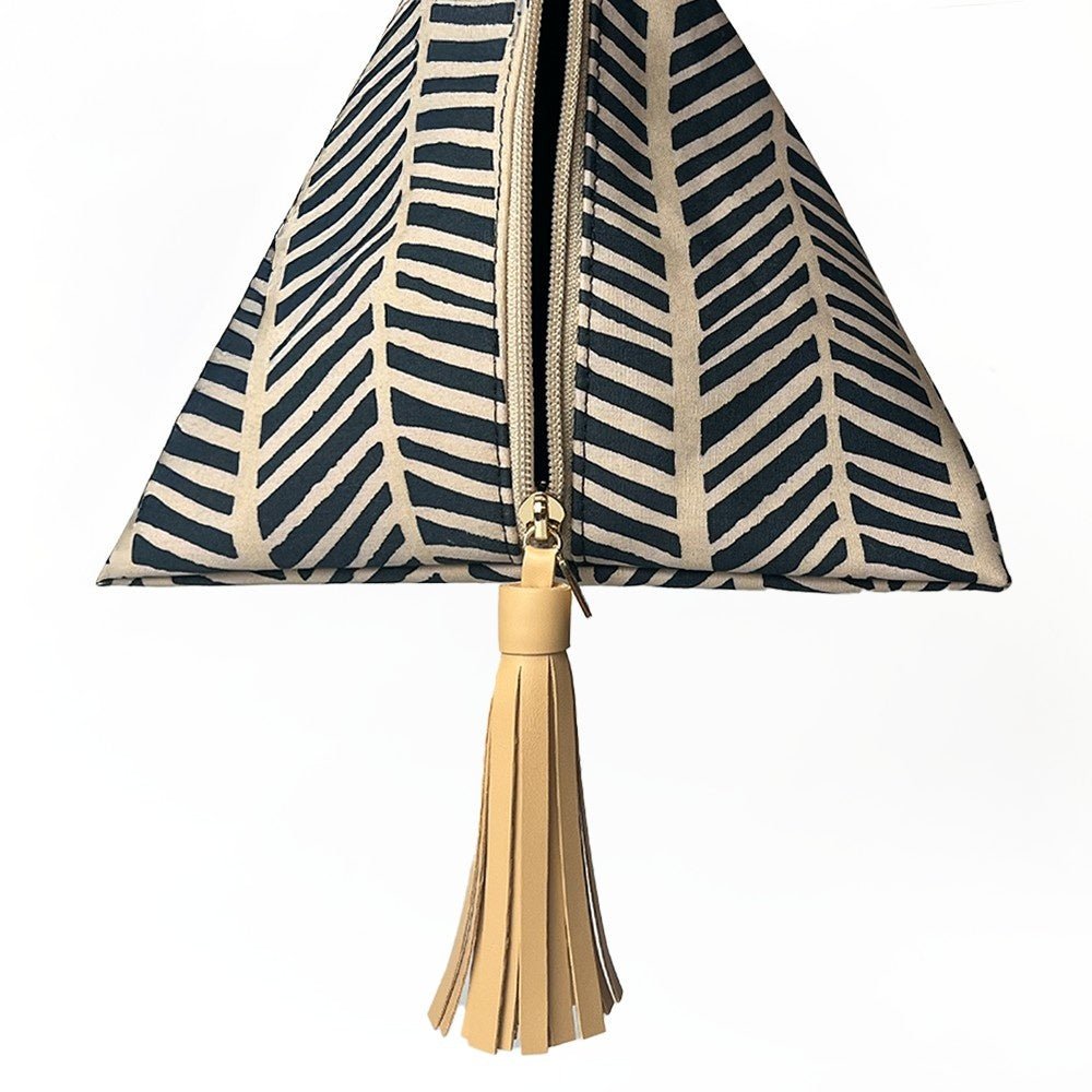 Batik Boutique’s Ketupat Bag in Black Banana Leaf print with natural tassel detail.