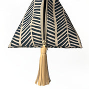 Batik Boutique’s Ketupat Bag in Black Banana Leaf print with natural tassel detail.