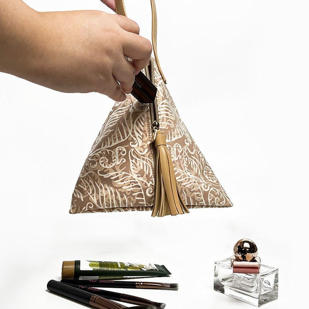 Ketupat Bag in Tan nautical bag storing makeup 