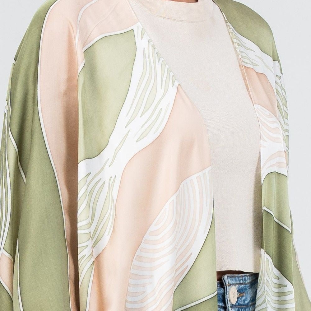 Close-up of Batik Boutique's Kimono in Moss Bukit print, highlighting the breathable silk cotton fabric and hand-drawn batik detailing