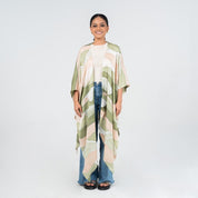 Front view of model wearing Moss Bukit batik kimono by Batik Boutique, styled casually with jeans and a white top